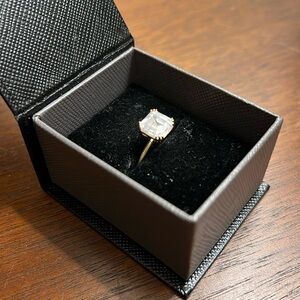 Made in Italy solid gold ring with cz or moissanite (not sure) cushion cut stone